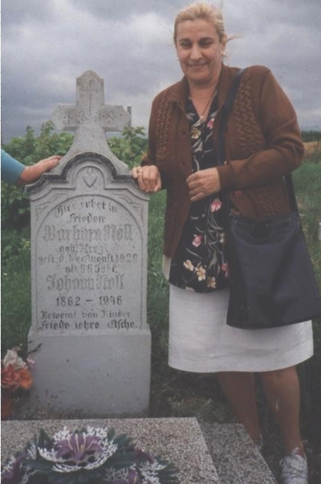 My late cousin Ana Noll when she visited Hungary, at our g-grandparents tombstone - photo taken in 1997